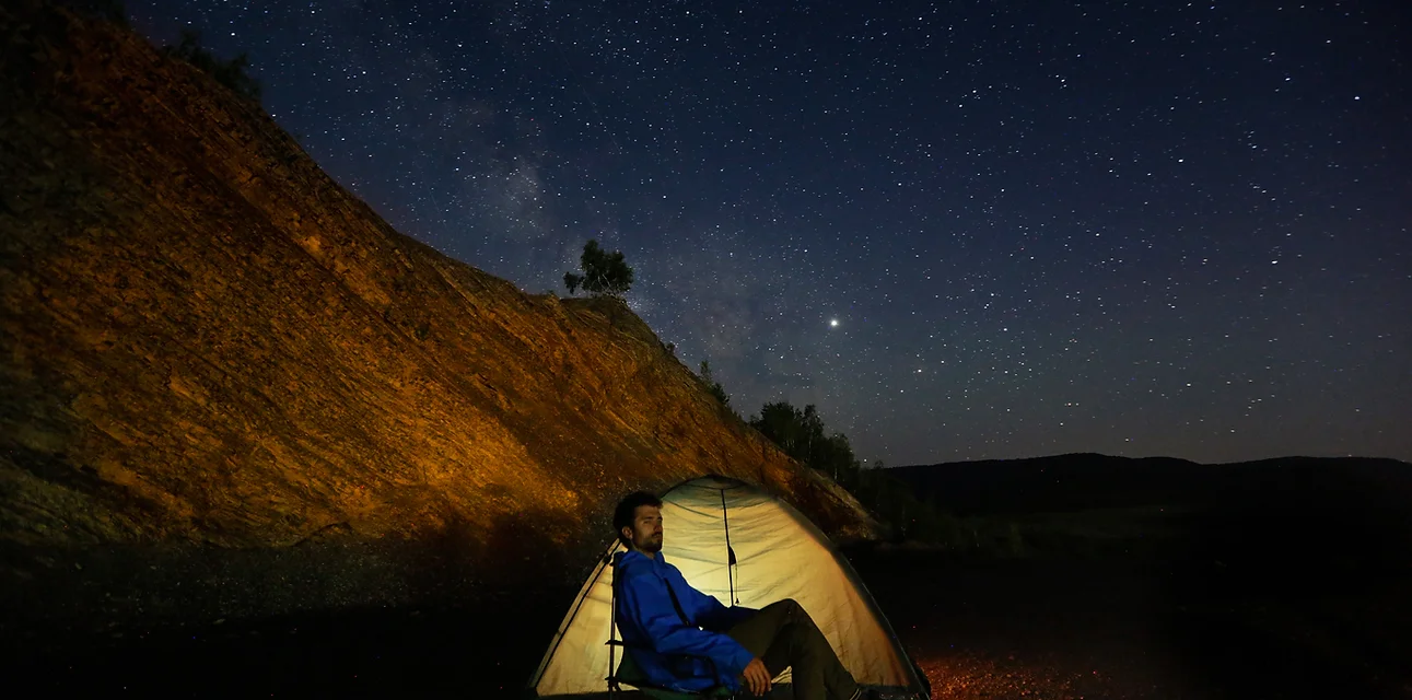 Camper Outside a Tent